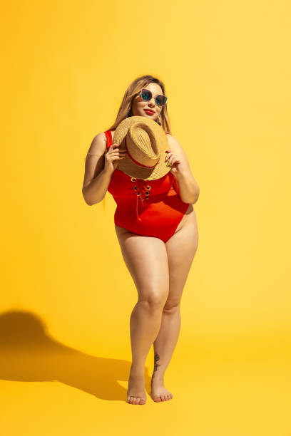 istock Young caucasian plus size female model's preparing for beach resort 1178957648