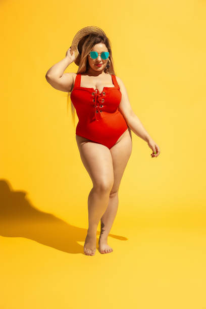 istock Young caucasian plus size female model's preparing for beach resort 1178957673