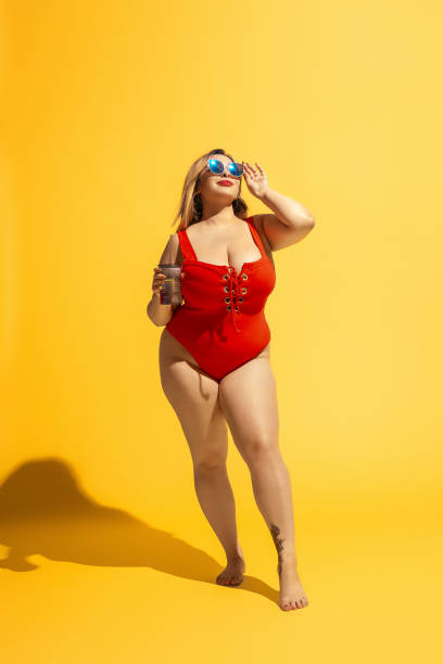 istock Young caucasian plus size female model's preparing for beach resort 1178957683