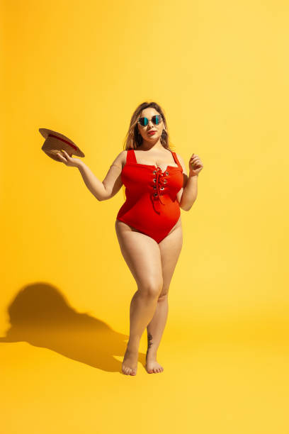 istock Young caucasian plus size female model's preparing for beach resort 1178957707