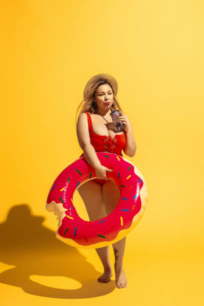 istock Young caucasian plus size female model's preparing for beach resort 1178958004
