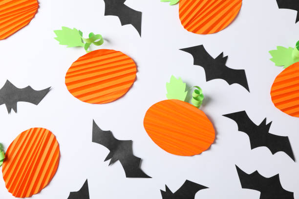 istock Applique bats and pumpkins on white. Halloween background 1178958888