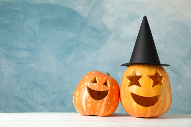 istock Funny pumpkins on white wooden background, space for text 1178958912