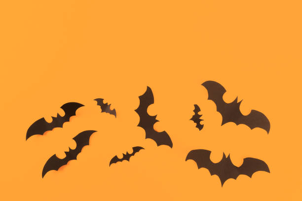 istock Halloween paper decorations on pastel   background. Halloween concept. Flat lay, top view, copy space 1178959086
