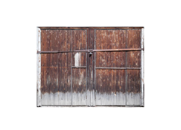 istock Old locked wooden gate isolated on white 1178959342