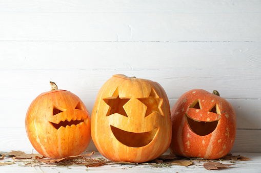 Halloween pumpkins on wooden background. Halloween concept