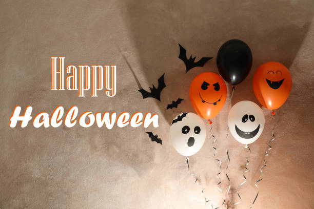 istock Different balloons on brown background. Halloween concept, space for text 1178959872