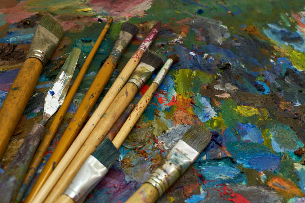 istock artists brushes and oil paints on palette 1178960126