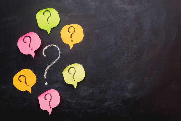 istock Pile of colorful paper notes with question marks. 1178960217