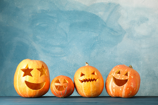 Halloween pumpkins on wooden background. Space for text