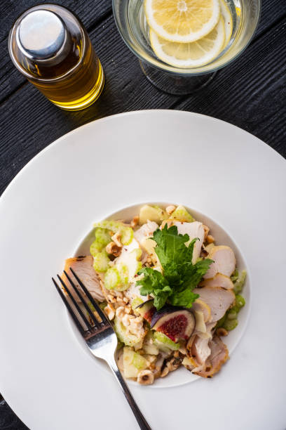 istock Grilled chicken breast salad with figs, green apple, celery, nuts and Parmesan. 1178961531