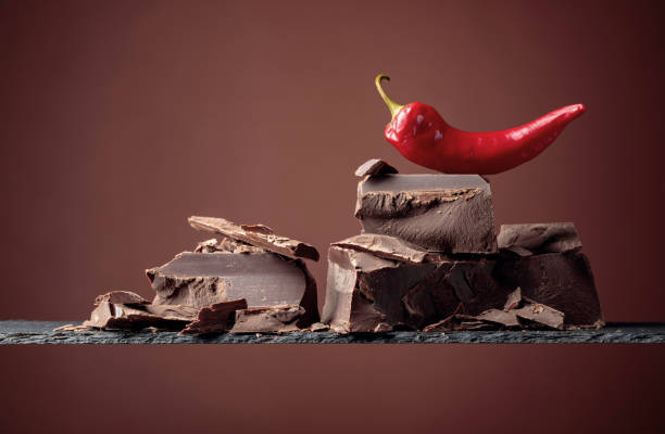 istock Black chocolate with red pepper on a brown background. 1178962764