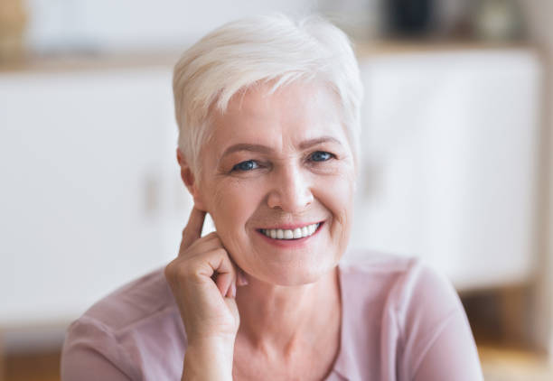 istock Attractive aged business woman smiling at camera 1178963614