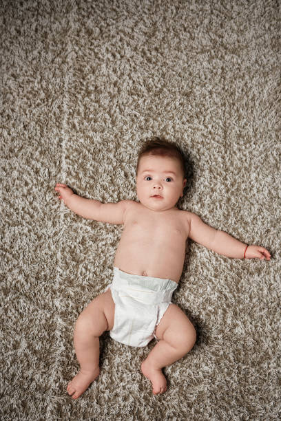 istock Baby girl wearing a diaper 1178964767