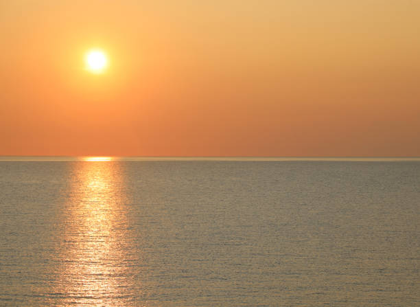 istock sun at sunset on the ocean 1178964844
