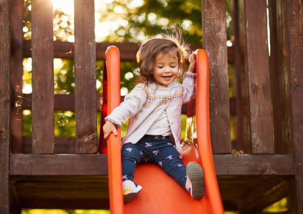 istock Sliding in the park, so happy 1178964957