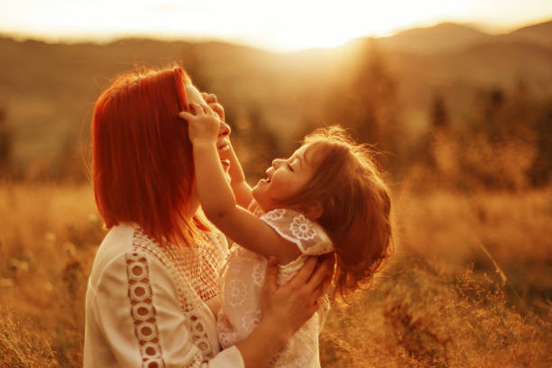 istock Girl touching mother's face 1178964975