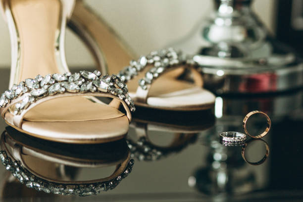 istock Wedding shoes and wedding rings 1178965029