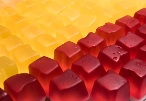 istock Red and yellow cube shaped jelly candy. 1178971093