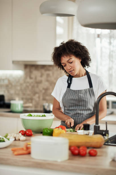 istock Woman chopping lettuce. 1178972499