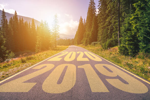 istock Empty asphalt road and New year 2020 concept. Driving on an empty road in the mountains to upcoming 2020 and leaving behind old 2019. Concept for success and passing time. 1178972721