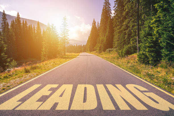 istock Leading word written on road in the mountains. Leading text on the road. 1178972733