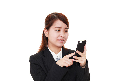 Business woman holding a smart phone