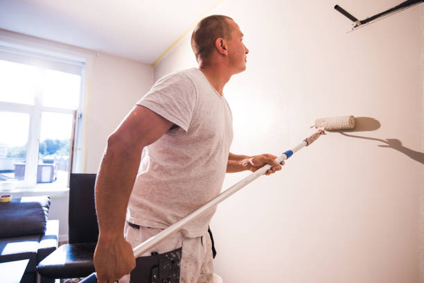 istock Profesional painter painting with paint roller. 1178975636