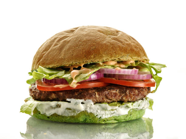 istock Fresh homemade delicious burger with a spinach bun. Isolated on white 1178980018
