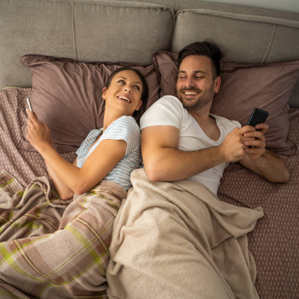 istock Young couple is resting in bed after work. 1178981147