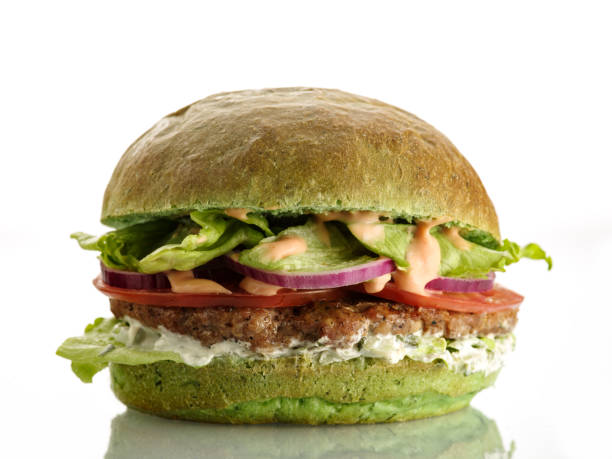 istock Fresh homemade delicious burger with a spinach bun. Isolated on white 1178981333