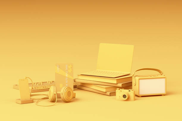 istock Laptop surrounding by colorful gadgets on yellow background. 3d rendering 1178981918