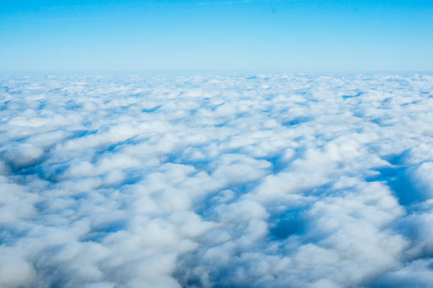 istock clouds from airplane window. View of the sky above the clouds 1178983280