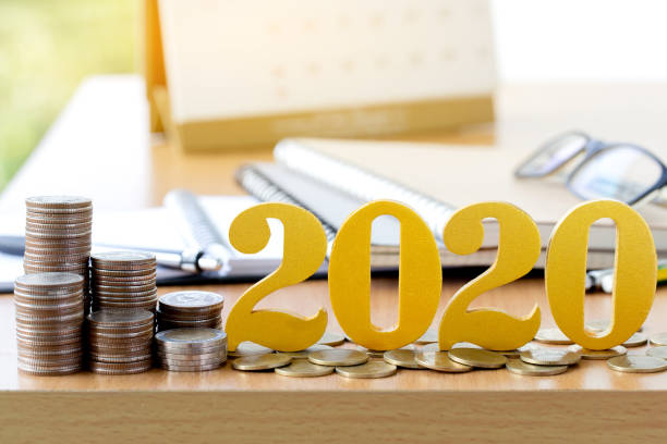 istock Word 2020 put on coins with coins stack on desk .Savings New year Concept. 1178984300