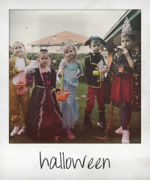 Instant photo of a group of kids during trick or treating