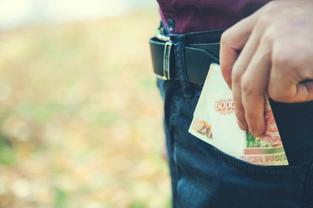 istock man hand money in pocket 1178985063