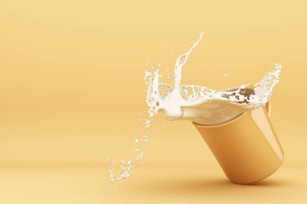 istock Pouring milk into a cup, milk splashing in yellow cup.3d rendering. 1178985136