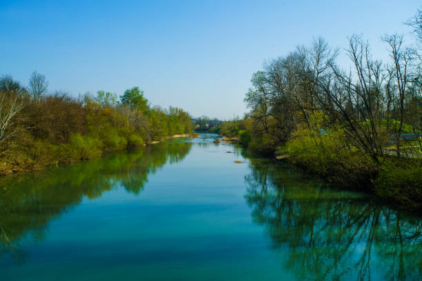 istock Blue river flowing across green forest 1178985591