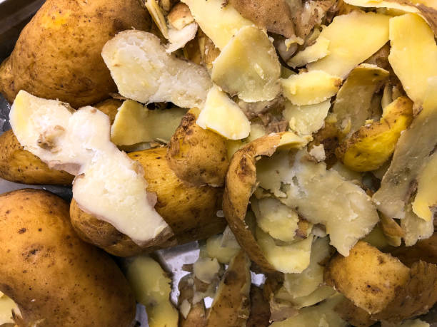 Peeled potato shells stock photo