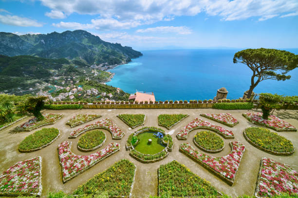 garden Villa Rufolo /  Ravello at the Amalfi coast Looking at the famous garden of the Villa Rufolo at the small city of Ravello on the Amalfi coast. Many of the small villages along the Amalfi coastline are hundreds of meters above sea level, because of the geographical reasons. The Amalfi coast is a stretch of coastline on the northern coast of the Salerno Gulf on the Tyrrhenian Sea, located in the Province of Salerno of southern Italy. The Amalfi Coast is a popular tourist destination for the region and Italy as a whole, attracting thousands of tourists annually. In 1997, the Amalfi Coast was listed as a UNESCO World Heritage Site. ravello stock pictures, royalty-free photos & images