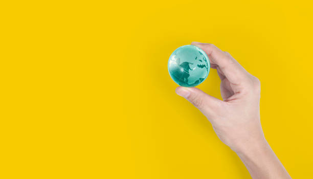 istock Globe ,earth in  hand, holding our planet glowing. Earth image provided by Nasa 1178997795