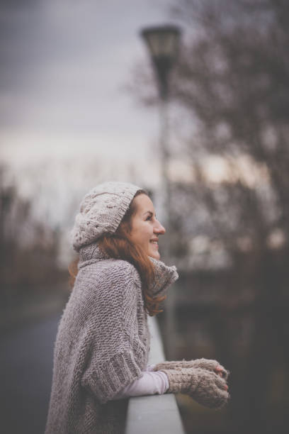 istock Young woman dressed in a warm woolen cardigan 1179003255