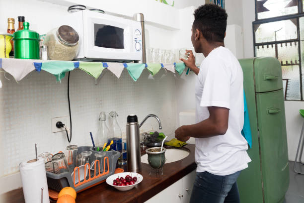 istock Black male preparing mate in his apartment alone 1179004122