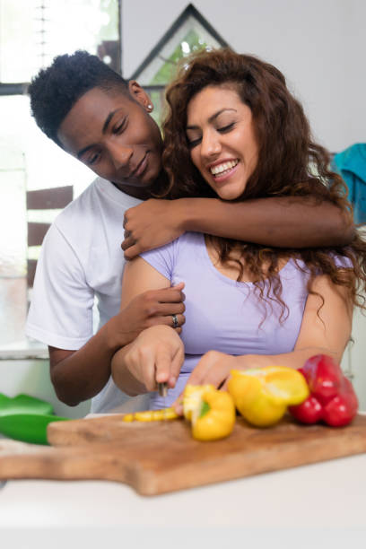 istock Young beautiful interracial couple making the dinner together 1179005376
