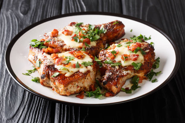 istock Festive menu fried pork chops with melted cheese and bacon closeup on a plate. horizontal 1179005585