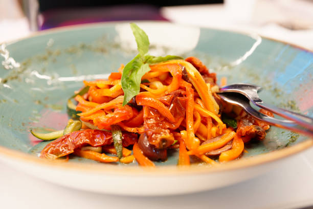 istock Vegetable appetizer with carrot, dried tomatoes and basil 1179007277