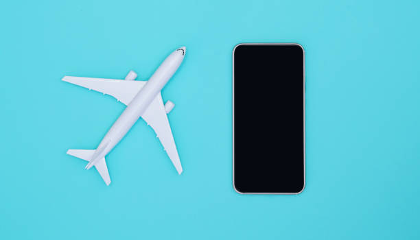 istock Smartphone and airplane on sky blue background. Smartphone application for online searching, buying and booking flights on the internet. Travel concept. 1179008040