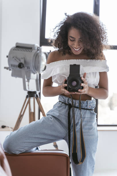istock Cheerful photographer getting ready for the photo session 1179008466