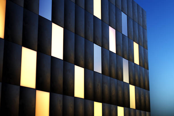 빛나는 창문이 있는 현대적인 건물 외부 전면 벽의 야경 - front panel 뉴스 사진 이미지