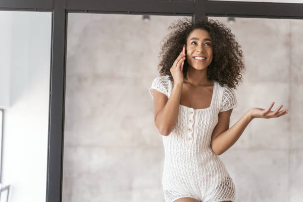 istock Cute curly haired female listening to her interlocutor 1179010129